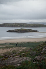 A small island during the low tide drive near the village of Teriberka, Barents Sea. Kola Peninsula, Russia.