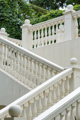 Railing with balusters on a white old staircase