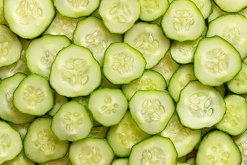 Sliced cucumber background. Texture of the fresh cucumber.