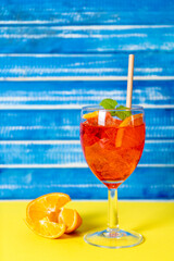 Vertical view of a glass with refreshing aperol spritz cocktail.