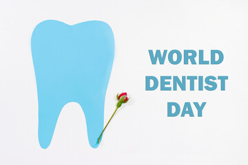 Greeting card for dentistry. Blue tooth and rose flower with text World dentist day on white.