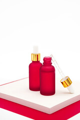 Serum cosmetic bottles, mockup of skin care products. Glass dropper bottle with a pippette and rubber tip. Minimalism style, organic spa cosmetics.