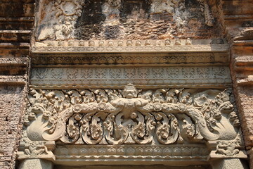 Carving on the pillar at Preah Ko temple, Cambodia