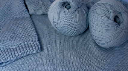 Pullover made of blue wool yarn. Handmade work. Merino wool. Needlework. Handmade work. Hobby.