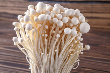 Fresh Enoki mushrooms  with selected focus.Enoki, also known as velvet shank, is a species of edible mushroom in the family Physalacriaceae.