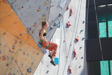 girl climbing up the wall