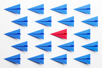 Blue paper airplanes on a white background with a red one in the center. Concept of leadership. 3d Render. - 446311394