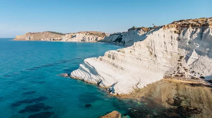 Foto auf Acrylglas Scala dei Turchi, Sizilien Scala dei Turchi,Sicily,Italy.Aerial view of white rocky cliffs,turquoise clear water.Sicilian seaside tourism,popular tourist attraction.Limestone rock formation on coast.Travel holiday scenery.