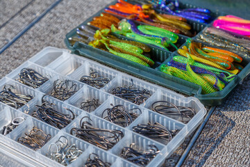 Fishing tackles and fishing baits in box .Classic Colored Fishing Lure , Beautiful Background digital image.Fishing on the lake at sunset. Fishing background.Fishing for spinning on the bass
