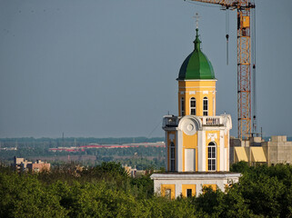 The upper part of the chapel with a crane towering over it