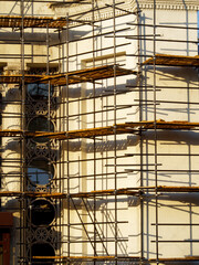  Reconstructed building with decorative elements in scaffolding