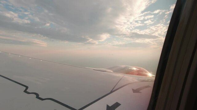 Airplane wing sun flare sunset slow motion