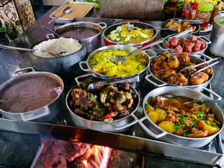 Minas Gerais cuisine made on a wood stove with rice, beans, feijoada, pork, pasta, sausage and...