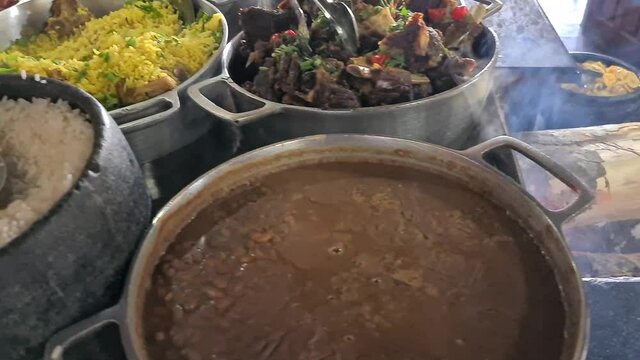 Minas Gerais cuisine made on a wood stove with rice, beans, feijoada, pork, pasta, sausage and chicken