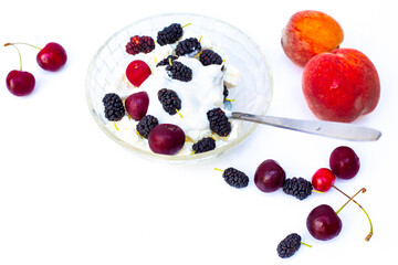 Delicious curd dessert with fresh ripe berries. Summer breakfast on a white background