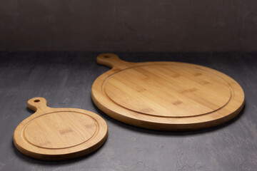 Pizza cutting board for homemade bread cook or baking on table. Empty pizza board at wooden tabletop