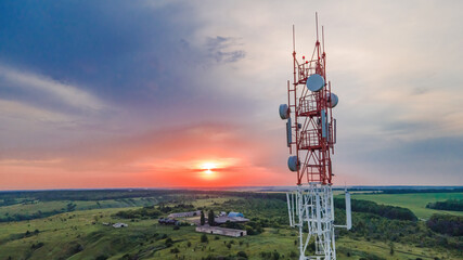 Telecommunication tower Antenna at sunset. Technology on the top of the telecommunication GSM 5G...