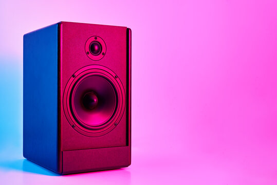 Stereo speaker on purple colored background. Sound audio loud speaker with copy space