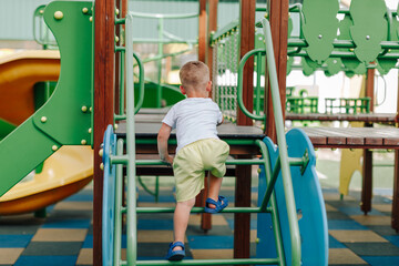 Fototapeta na wymiar child playing on the playground