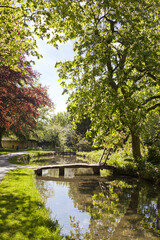 Fototapeta na wymiar The River Eye flowing through the Cotswold village of Lower Slaughter, Gloucestershire UK