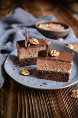 Opity Izidor, sweet dessert with walnut filling and chocolate frosting