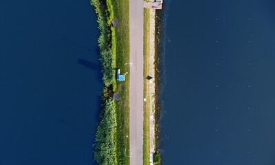 Aerial view of a beautiful dam with a road in the middle of the lake