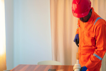 Man is repairing a pipe at home