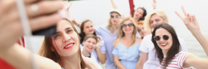 Cheerful women on board the boat take a selfie