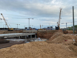 Construction of a large underground infrastructure industrial facility with a foundation using powerful construction cranes