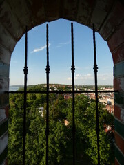 City panorama viewed through barred window of the Klimek Tower, Grudziądz, Poland