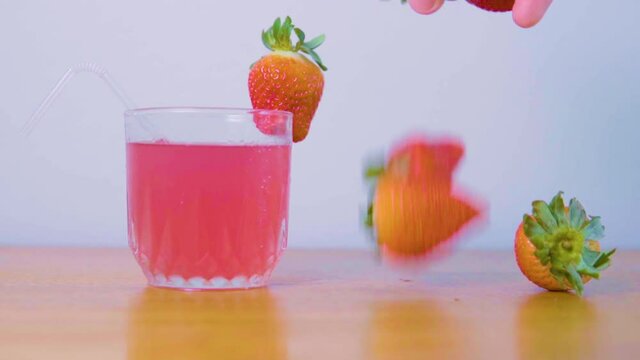 making a strawberry drink for summer