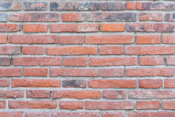 Obraz premium Aged brick wall of earthy color, rustic, industrial