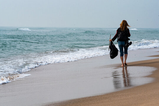cleaning trash on the beach voluntarily