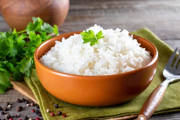Fototapeten White rice in bowl on table © qwartm
