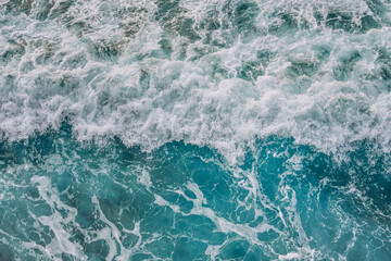 Top view shot of bali sea with splashing waves