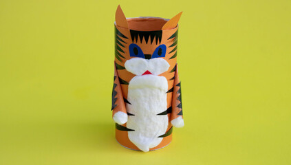 DIY a tiger from a toilet paper sleeve for the Chinese new year. Create paper crafts for children