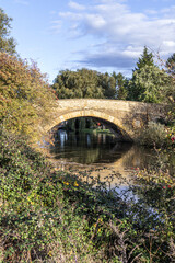 Fototapeta na wymiar Tadpole Bridge built of stone over the River Thames in the late 18th century near Bampton, Oxfordshire UK