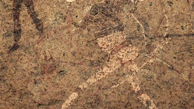 Closeup of ancient prehistoric cave painting known as the White Lady of Brandberg dating back at least 2000 years and located at the foot of Brandberg Mountain in Damaraland, Namibia, Africa. 