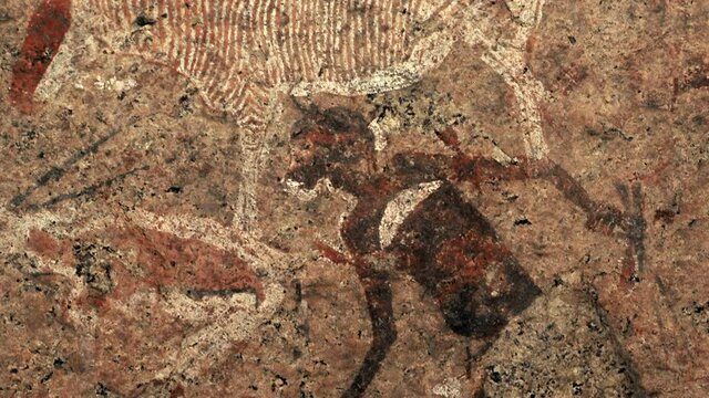 Detail of ancient prehistoric cave painting known as the White Lady of Brandberg dating back at least 2000 years and located at the foot of Brandberg Mountain in Damaraland, Namibia, Africa.