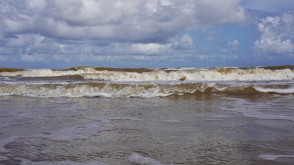 this is a picture of the waves crashing onto a local beach.