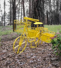 Old fashioned metal yellow bicycle  