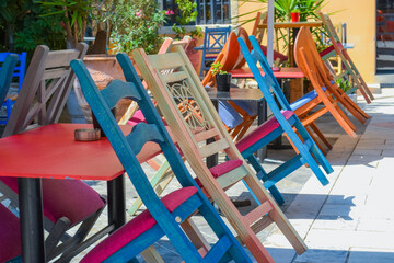 Cafe multicolored chairs. Greece, Corfu