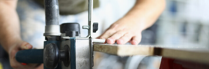 Carpenter fixes workbench for working with wood