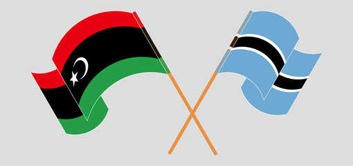 Crossed and waving flags of Libya and Botswana - obrazy, fototapety, plakaty