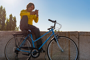 Fototapeta na wymiar Caucasian man riding bicycle in the city