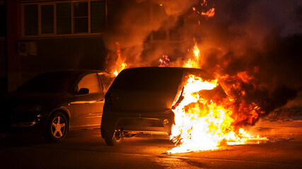 car in flames at night
