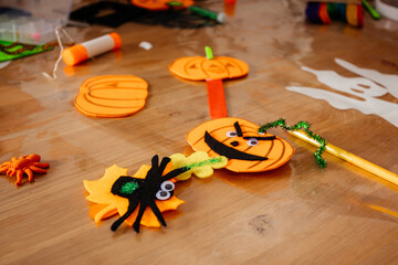 Funny Halloween pumpkins made of felt and paper, top view