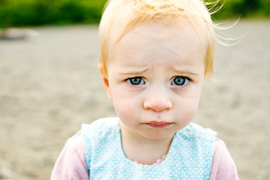 Closeup cropped portrait of a concerned young girl