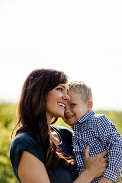 Close Up of Mother & Son in Wildflower Field