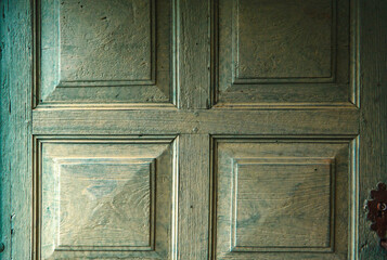  An old and rustic wooden door from the fifties as backdrop.